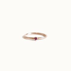 July’s birthstone - tiny ruby ring on our signature bark texture 14k yellow gold band. Dainty, delicate beauty. Perfect a lady who is not a fan of chunky gemstones, this ring won't get tangled in your clothes or hair. Match perfectly when you wear it with our dainty rings. Made of 14K yellow gold. Genuine ruby size 2 mm. Band width approximately 1.2 mm. Promise Ruby Ring In 14k Gold, Ethically Sourced, Minimalist Ruby Ring With Birthstone, Minimalist Ruby Ring Birthstone, Minimalist 14k Yellow Gold Ruby Ring, Minimalist Yellow Gold Ruby Birthstone Ring, Minimalist Yellow Gold Ring With Ruby, Stackable 14k Gold Ruby Ring For Promise, 14k Gold Stackable Ruby Promise Ring, Promise Stackable 14k Gold Ruby Ring