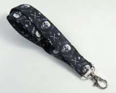 This lanyard has skulls on black. You can have a wardrobe of lanyard to match your outfit. This lanyard is made of soft 100% cotton fabric to give a comfortable feel around your neck. This lanyard is easy to take care. You can spot clean and throw in a washer and hang dry. If you want you can iron and it is ready to use. These lanyards are perfect if you have metal allergy. Each of these lanyards will have a slight different pattern depending on where fabric is cut on pattern. This lanyard measu Custome Lanyard, Lanyard With Pins, Black Lanyard With Key Leash As Gift, Halloween Lanyard, Adjustable Black Badge Holder With Key Leash, Yoobi Lanyard, Lanyard With Id Holder, Fabric Lanyard, Key Lanyard