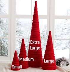 three red cones with the words extra large, medium, large and small written on them