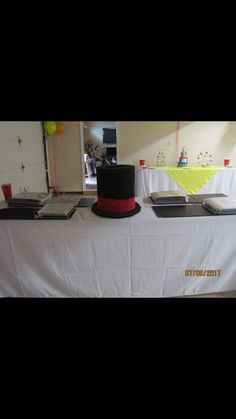 a table topped with a black top hat