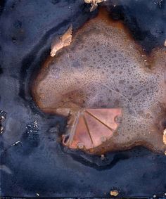 an aerial view of the ocean and sand