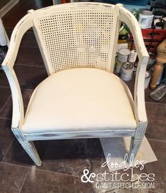 a white chair sitting on top of a tiled floor