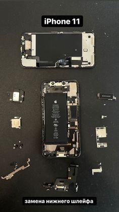 an iphone is shown with parts removed from the front and back sides, which are sitting next to each other