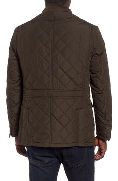 A belted collar refines a classic diamond-quilted jacket that's roomy enough for warm winter layering and stylish enough for the city. 30" length (size Medium) Hidden two-way zip closure with outer button placket Stand collar with buckle closure Long sleeves with three-button cuffs Front button-flap cargo pockets; interior chest pocket Lined 100% polyester Machine wash, dry flat Imported Barbour Quilted Jacket, Olive Jacket, Barbour Jacket, Navy Jacket, Wax Jackets, Quilt Jacket, Winter Layering, Navy And Brown, Green Jacket