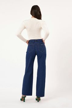 This is a high-rise, wide leg jean, made with a low stretch denim. Fits true to size. The Heidi: Tight around the seat but will soften with wear Features our signature back pocket stitching Specially angled and shaped in the back for a truly peachy looking butt Low stretch denim for a vintage look with the comfort of a stretch Zip closure Made with Rolla's vintage gold hardware The Measurements: Rise: 31 cm / 12 inch Inleg: 83 cm / 32 inch Hem: 49cm / 195 inch *Measurements for size 8 The Wash: Dark stone is a classic rich dark blue wash Crafted with contrast tobacco stitching The Stretch: Comfort denim, sometimes known as 'comfort rigid' Slightly lighter weight than a rigid denim Designed for those who want an authentic vintage look to their denim with a little bit of stretch Comfort deni Pocket Stitching, Vintage Indigo, Activewear Sets, Kimono Jacket, Denim Design, Romper Dress, New Tops, Cardigan Jacket, Jeans For Sale