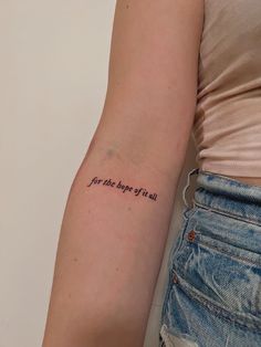 a woman's arm with a tattoo saying for the age of all