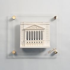 a model of the parthenon in acrylic glass with gold studs