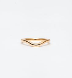 Simple and elegant, the polished form of this curved gold band makes a perfect complement to all of Single Stone's signature engagement rings. The gentle contour delicately traces around solitaires, halos, and geometric settings alike. You can even wear it in multiples or as a matched pair for even more stacking options. Made in the U.S.A. Measures 2.0 mm wide. Also available in DIAMOND. All sizes available by special order in 4-6 weeks. To inquire, including requests for alternate metal options Contour Band, Single Stone, Gold Band, Gold Bands, Halo, Fashion Beauty, Fine Jewelry, Engagement Rings, Band