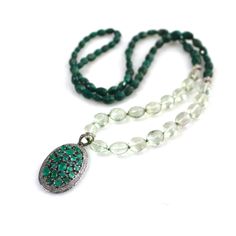 "Very gorgeous, finely faceted Green Emerald stones are exceptional gems full of shine, sparkle and amazing natural color. They are embellished with a stunning large faceted Emerald and quite luxe black diamond pendant from which hangs a strand of finely faceted prasiolite. The pale green finely faceted stones throw off beautiful light. Small diamond set beads add a bit of elegance to the strand which finishes with vibrant faceted nuggets of green emeralds, The length is 27\" long and has no cla Luxury Round Faceted Necklaces, Luxury Gemstone Beads, Luxury Necklaces With Faceted Beads For Jewelry Making, Elegant Crystal Necklaces With Gemstone Accents, Luxury Faceted Pendant Jewelry, Elegant Crystal Necklaces With Gemstone Accents For Healing, Luxury Green Stone Necklaces, Luxury Pendant Jewelry With Stones, Diamond Pendant With Gemstone Accents