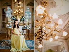 a woman in a yellow dress sitting on a blue rug next to a chandelier