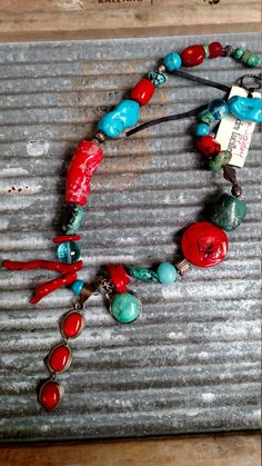 "Wearable Art for the unique fashion forward individual that never wears ordinary. This one of a kind necklace includes a variety of turquoise and coral.  A array of complimentary stones include crystals, glass and Bali silver. I have added a turquoise dangle for interest. Step outside your box and grab some attention. Ordinary doesn't cut it for you.  Toggle closure. Fast Free Shipping The necklace measures 24\" Item # 504" Handmade Eclectic Red Jewelry, Eclectic Turquoise Round Bead Jewelry, Artisan Turquoise Necklace, Unique Turquoise Necklace For Festival, Unique Turquoise Necklaces For Festivals, Multicolor Handmade Artisan Turquoise Necklace, Handmade Multicolor Artisan Turquoise Necklace, Unique Turquoise Pendant Beaded Necklaces, Unique Turquoise Pendant Beaded Necklace