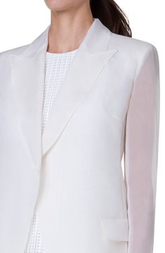 Tailored from filmy silk gauze with the sleeves left sheer, this structured blazer adds exceptional polish to your warm-weather look. Open front Peaked lapels Side flap pockets 100% silk Dry clean Imported Designer Clothing White Silk Blazer For Workwear, White Silk Blazer For Work, Long Sleeve Silk Suit For Office, Designer White Evening Blazer, White Silk Blazer For Wedding, Chic Silk Blazer For Wedding, White Silk Wedding Blazer, Tailored White Silk Suit, Spring Silk Formal Blazer