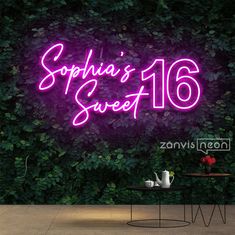 there is a purple neon sign that says sophinia's sweet 16 on it