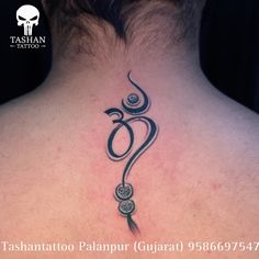 the back of a woman's neck with an omen symbol tattoo on it