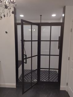 an open door leading into a room with black and white polka dots