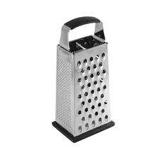 a grater that is sitting on top of a white surface with black trimmings