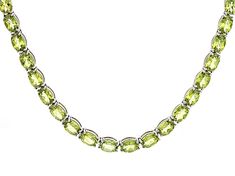 52.95ctw Oval Peridot Rhodium Over Sterling Silver Tennis Necklace. Measures Approximately 0.18"W. Lobster Claw Clasp With 1.5" Extender. Oval Green Peridot Necklaces, Formal Oval Peridot Jewelry, Oval Peridot Jewelry For Formal Occasions, Classic Lime Green Oval Jewelry, Formal Lime Green Gemstone Jewelry, Lime Green Gemstone Jewelry For Formal Occasions, Peridot Gemstone, Tennis Necklace, Broken Chain