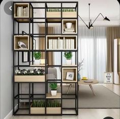 a living room filled with lots of books and plants