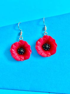 Beautiful Poppy Flower dangler earrings, to brighten up your day. Dainty and cute. The hook is made of plated sterling silver to protect your ears and the the Poppy Flower is made of resin They come well presented and wonderful for a birthday present for a friend, family or your loved one. I offer free postage and will despatch within a day of purchase Thank you for taking the time to look at my earrings and please visit my UK shop for more original designs.  Bespokedanglers. Thanks Sharlene xx Red Flower Charm Earrings, Red Flower Earrings With Ear Wire, Red Flower Drop Earrings, Red Flower Earrings For Gift, Red Flower Earrings As Gift, Red Flower Shaped Sterling Silver Jewelry, Red Sterling Silver Flower-shaped Jewelry, Red Sterling Silver Jewelry In Flower Shape, Red Drop Earrings With Flower Charm