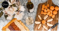 an assortment of food and wine on a table