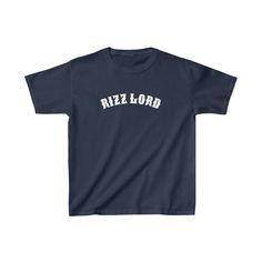 Celebrate Valentine's Day in style in our new kid's Rizz Lord t-shirt! This one of a kind Gildan t-shirt is definitely going to be the funniest shirt at school.  The kids heavy cotton tee is perfect for everyday use. The fabric is 100% cotton for solid colors. Polyester is included for heather-color variants. These fabrics are prime materials for printing. The shoulders have twill tape for improved durability. The collar is curl resistant due to ribbed knitting. There are no seams along the sides.  .: Made with 100%, midweight (5.3 oz/yd² (180 g/m US cotton that feels soft to the touch and a great choice for any season. .: The crew neckline along with the tee's classic fit, deliver a timeless style that is perfect for daily use. .: All t-shirts come with pearlized, tear-away labels for tot Blue Graphic Print T-shirt For School Events, Blue Pre-shrunk T-shirt For School Events, School Crew Neck T-shirt With Logo Print, School Graphic Tee With Name Print, School T-shirt With Logo Print, Crew Neck, Casual T-shirt With Name Print For School Events, School Spirit T-shirt For School Events, School Spirit T-shirt With Text Print For School Events, Graphic Tee With Funny Text For School