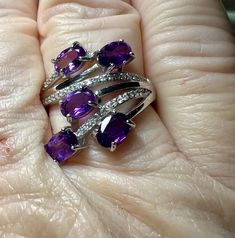 Gemstone: genuine natural oval cut amethyst Size: 6mm x 4mm x 2mm Weight: 1.25cttw approx. Accent stones: round cut white topaz Metal: .925 stamped Sterling Silver, rhodium plated & 18kt gold played Size: adjustable 8 1/2 to 10 Weight: 3.8g Oval Purple Diamond Gemstones, Oval Multi-stone Amethyst Gemstones, Oval Amethyst Cubic Zirconia Ring, Oval Amethyst Ring With Cubic Zirconia, Oval Purple Amethyst Ring With Cubic Zirconia, Oval Amethyst Gemstones With Prong Setting, Oval Purple Cubic Zirconia Jewelry, Purple Oval Stone Jewelry, Purple Oval Cubic Zirconia Jewelry