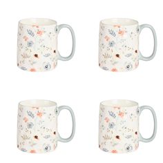 four coffee mugs with different designs on them