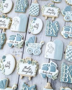 baby shower cookies are arranged on a table