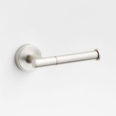 a close up of a door handle on a white wall