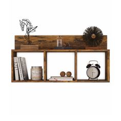 a wooden shelf with books, an alarm clock and other items on top of it