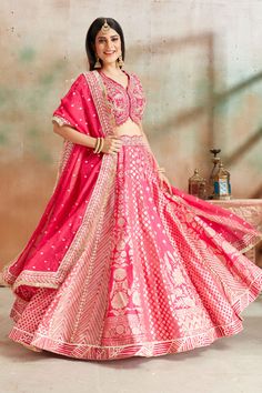 Go for a beautiful traditional look at weddings in this exquisite fuchsia pink embroidered Banarasi silk lehenga. The lehenga comes with a beautiful dupatta. Pink Chanderi Lehenga With Cutdana, Pink Chanderi Choli With Resham Embroidery, Pink Resham Embroidery Choli In Chanderi, Pink Anarkali Set With Intricate Embroidery In Art Silk, Pink Raw Silk Lehenga For Navratri, Pink Chanderi Lehenga With Traditional Drape, Pink Chanderi Lehenga With Resham Embroidery, Pink Art Silk Dupatta With Intricate Embroidery, Pink Banarasi Silk Lehenga With Intricate Embroidery