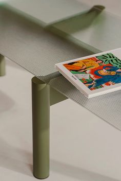 a book sitting on top of a metal table