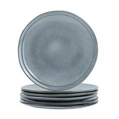 four plates stacked on top of each other with one plate in the middle and two are empty