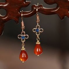 This pair of beautiful red natural stone with blue crystal drop earrings is a great addition for elegant styling. It also makes wonderful gift for your loved ones. 🌸 Please avoid water, oil and any chemical to maintain this product. 🌸 All products are made with high-quality material to give them the best durability and stylish appeal. 🌸 MATERIAL: Natural stone Gold plated  Blue crystals 🌸 SIZE & DETAILS:  Length: 1.7"(4.5cm) 🌸 SHIPPING INFORMATION All the items ship from Vancouver, BC. Depe Vintage Earrings With Natural Stones For Gift, Red Drop Crystal Earrings As Gift, Natural Stone Drop Earrings For Gift, Vintage Natural Stone Earrings For Gift, Natural Stones Dangle Teardrop Earrings As Gift, Natural Stone Dangle Teardrop Earrings As Gift, Natural Stone Crystal Drop Earrings For Gift, Crystal Gemstone Drop Earrings Gift, Natural Stone Crystal Drop Earrings Gift