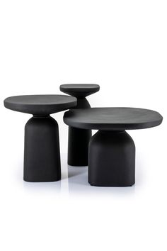 three black tables sitting next to each other