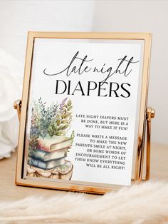 there is a sign that says late night diapers on the table next to some flowers