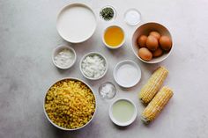 ingredients for corn on the cob laid out in bowls