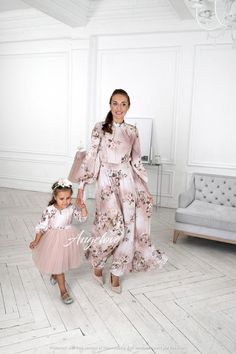 A set of dresses for mom and daughter.Luxurious silk dresses with floral print. They are incredibly cool. Delicate dresses, at the same time very elegant. The classic style of dresses will always be relevant. Agree, it looks amazing. Indulge yourself with luxurious looks with Family look from Angelove!The dress comes with a removable belt.A fluffy dress for a girl with a pale pink skirt. The top is made of matte silk with floral print. 100% cotton lining, deep-opening zipper for the comfort of e Dresses For Mom And Daughter, Pale Pink Skirt, Fluffy Dress, Daughter Dress, Mommy Daughter Outfits, Mother Daughter Fashion, Maxi Dress Long Sleeve, Mother Daughter Dress, Mommy And Me Dresses