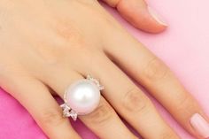 For Sale on 1stDibs - This pearl and diamond ring features a large South Sea pearl of 18mm diameter. The pearl is untreated. It displays a splendid nacre and its natural color Mother Of Pearl Wedding Ring, Wedding Pearl Ring With Mother Of Pearl, Luxury Pearl Ring As A Gift, Elegant Mother Of Pearl Ring As Gift, Wedding Pearl Ring In Mother Of Pearl, White Mother Of Pearl Wedding Ring, Luxury Elegant Pearl Ring With Pearl Drop, Formal Mother Of Pearl Ring, Formal Mother Of Pearl Round Ring