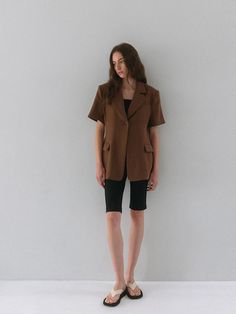 This is a minimal and modern jacket by dankedir that is made out of high quality and sturdy material. With distinctive mood of the design and comfortable wear, you can style it for your clean daily outfit.- Slim waistline and long length- Logo engraved ox horn buttons- Trendy and feminine mood Brown Relaxed Fit Outerwear For Work, Modern Brown Outerwear For Office, Short Sleeve Blazer For Office In Fall, Modern Brown Outerwear For Business Casual, Classic Short Sleeve Single Breasted Outerwear, Modern Fitted Short Sleeve Outerwear, Short Sleeve Outerwear For Office In Fall, Short Sleeve Fall Blazer For Workwear, Spring Brown Sport Coat For Workwear