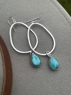 This is a pair of handcrafted sterling silver and Whitewater Turquoise dangle earrings - a gorgeous statement earring (that is relatively lightweight!) that flaunts a stunning pair of whitewater turquoise stones. The stones remind me of the ocean :)  These earrings are incredibly versatile - great dressing up an outfit with a T-shirt and jeans, and also a perfect jewelry option for dressing up for a special event! Dangling from sterling silver teardrops, these Whitewater turquoise stones add a p Sterling Silver Teardrop Jewelry With Natural Stones, Turquoise Sterling Silver Dangle Jewelry, Turquoise Dangle Jewelry In Sterling Silver, Turquoise Sterling Silver Pierced Jewelry, Pierced Turquoise Sterling Silver Jewelry, Turquoise Drop Bohemian Jewelry, Bohemian Turquoise Drop Jewelry, Artisan Turquoise Drop Earrings Jewelry, Turquoise Drop Sterling Silver Jewelry