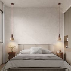 a large bed sitting in a bedroom next to two lamps on either side of it