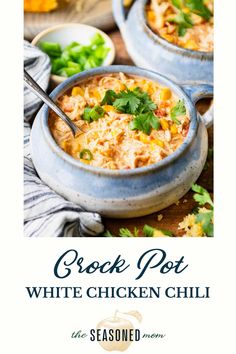 two bowls filled with white chicken chili and garnished with cilantro