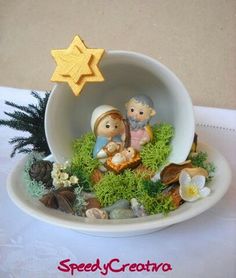 there is a small nativity scene in the bowl