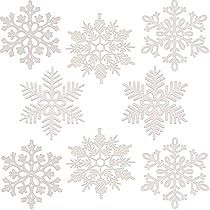 six snowflakes are shown in white on a white background, each with different shapes and sizes