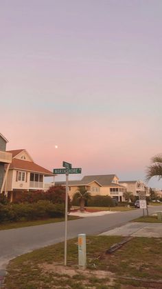 the street signs are clearly visible for us to see in this photo at sunset or dawn