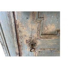 an old blue door with rust on it