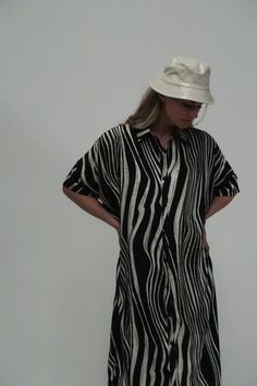 Zebra printed fabric Standard collar Button down Shirt dress Midi length Relaxed fit Imported 100% POLYESTER Model is 5 ft 10 in. Wearing a Small Caring for your clothes is caring for the environmentWash your clothes with lower temperature and delicate spin cycles. It helps to maintain the color, shape and structure of the fabric. At the same time it reduces energy consumption that is used in care processes. ONE SIZE ME3037_BLACK_ALL Fitted Black Shirt Dress For The Beach, Black Collared Shirt Dress For Beach, Black Collared Shirt Dress For The Beach, Black Relaxed Fit Collared Dress, Black Collared Dress With Relaxed Fit, Black Relaxed Fit Button-up Shirt Dress, Black Relaxed Fit Shirt Dress With Short Sleeves, Black Short Sleeve Shirt Dress For Vacation, Black Button-up Shirt Dress For Beach