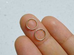 Pair of 14k gold filled hoop rings.Choose from drop down menu gauge and diameter24g22g20gInner diameter 6mm8mm10mm Rose Gold Nose Ring, Helix Ring, Tragus Hoop, Cartilage Ring, 14k Gold Hoop Earrings, Helix Hoop, Ear Piercings Cartilage, Gold Nose Rings, Cartilage Hoop