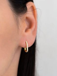 "Dainty and elegant, these minimalist rectangle hoop earrings are prong-set with sparkly cubic zirconia gemstones and are a beautifully dainty addition to your everyday jewelry. Classic, versatile and perfect to mix and match with other earrings.  ∙ Sold individually (1 earring) or in pairs (2 earrings). Both options are available in the dropdown menu. * D E T A I L S * ∙ Material: .925 Sterling Silver or 18K Gold Plated over .925 Sterling Silver ∙ Stone: White Zirconia  ∙ Dimensions 10mm x 15mm Modern Everyday Huggie Earrings With Cubic Zirconia, Modern Cubic Zirconia Huggie Hoop Earrings, Modern Cubic Zirconia Hoop Earrings For Everyday, Modern Everyday Cubic Zirconia Hoop Earrings, Minimalist Cubic Zirconia Hoop Earrings, Rectangle Hoop Earrings, Jewelry Classic, Dainty Hoop Earrings, 2 Earrings